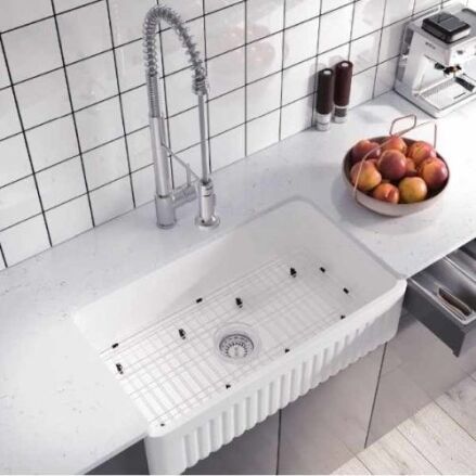 PL-FC3318SB white fireclay reversible farmhouse kitchen sink installed in a countertop